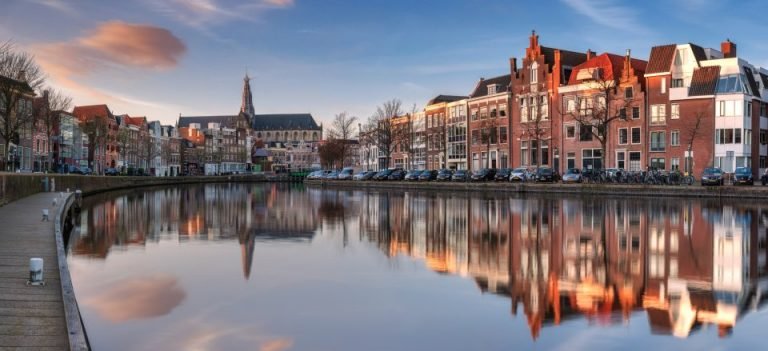 Historic canal houses reflected in the water
