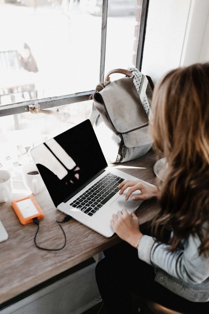 Woman working on a laptop at a desk