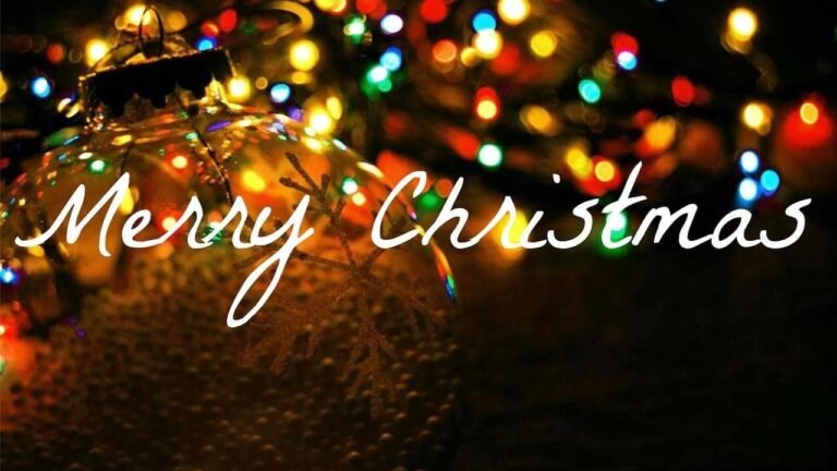 "Merry Christmas" lettering over blurred festive lights