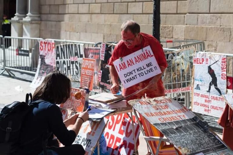 People at a street protest holding signs