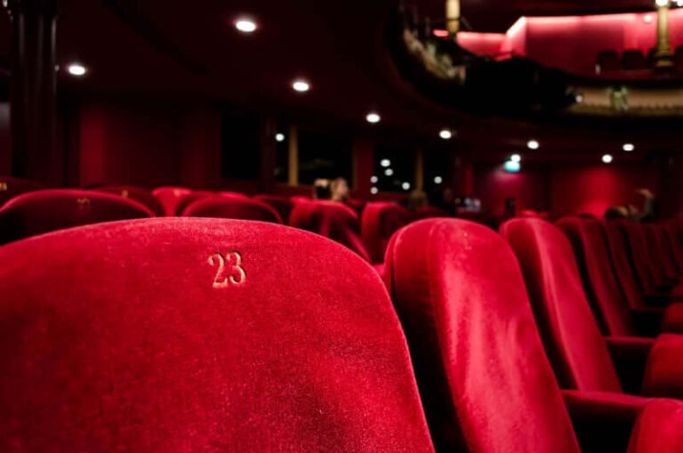 Rows of empty red theatre seats