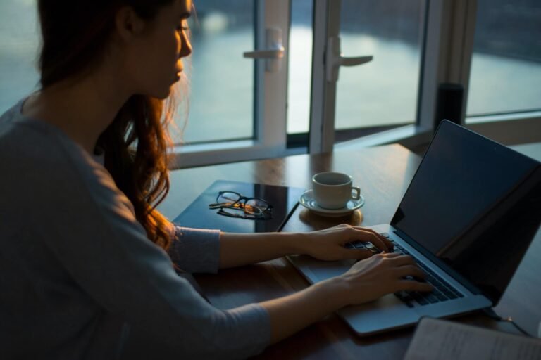 Woman working on a laptop at home