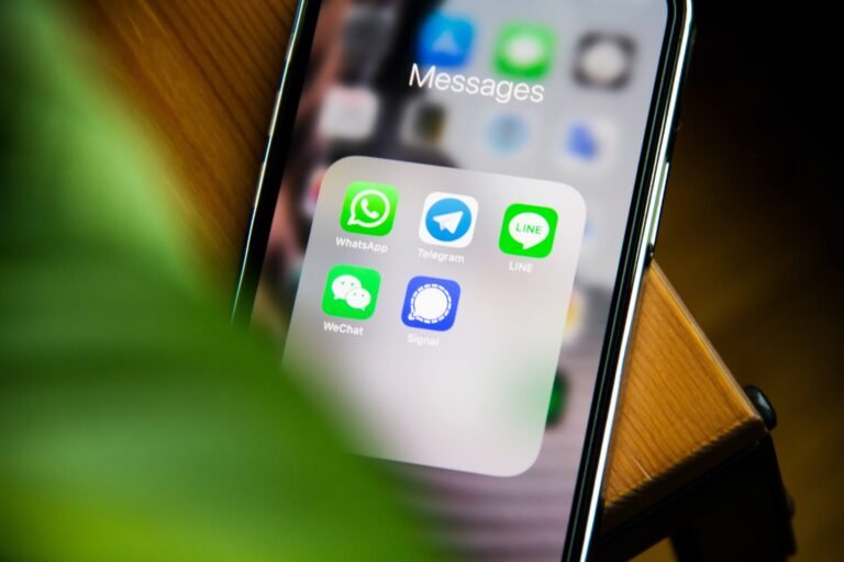 Smartphone home screen with WhatsApp and other app icons
