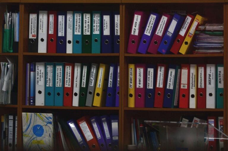 Shelves full of coloured document binders