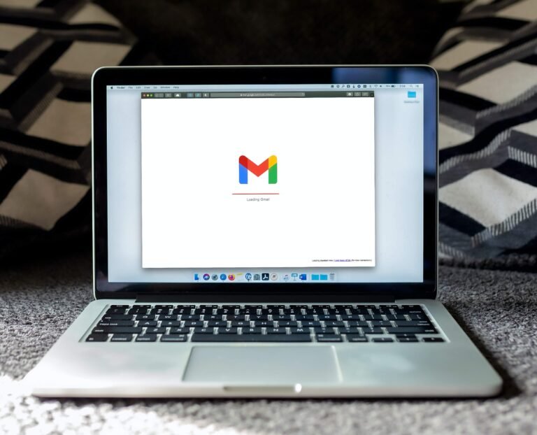 Laptop showing the Gmail logo on screen