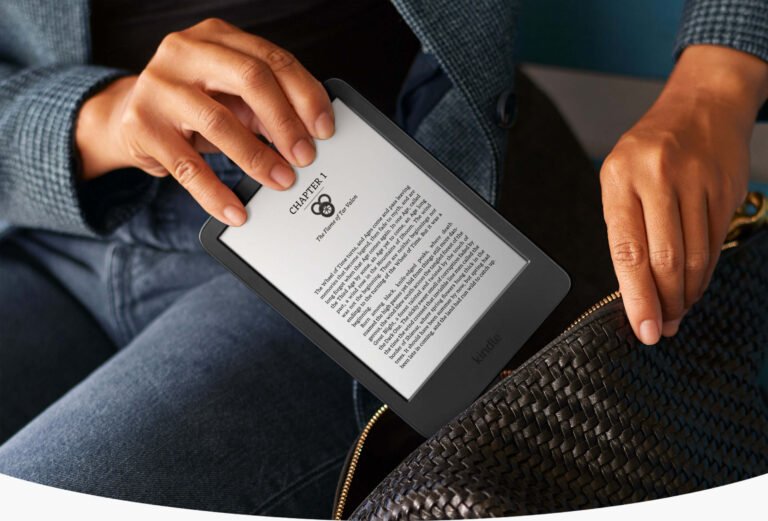 Person holding an Amazon Kindle e-reader
