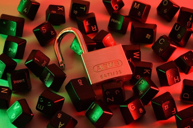 Padlock on a red-lit computer keyboard