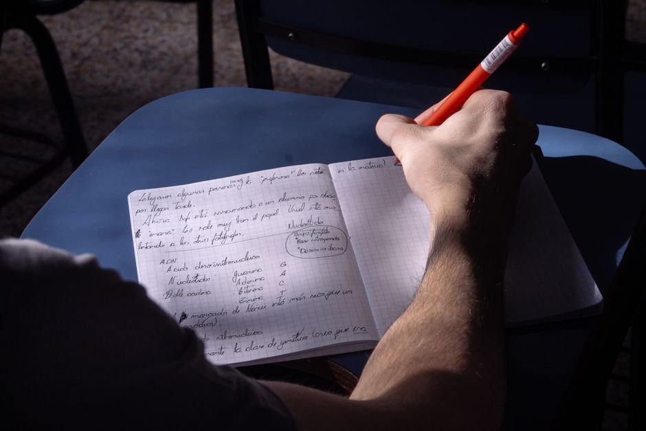 Person reviewing meeting notes and action items at desk