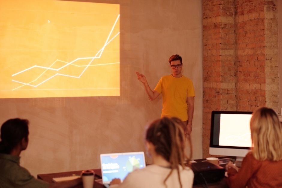 Business professional presenting proposal to client in office meeting