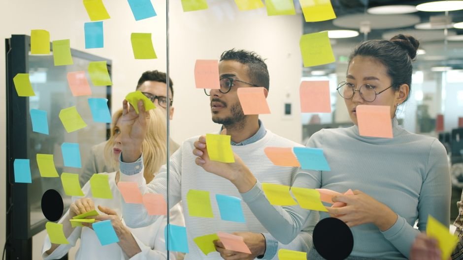 Team collaborating with sticky notes during a sprint retrospective session