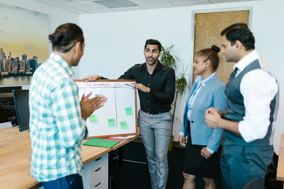 Team collaborating on AI workflow strategy during meeting