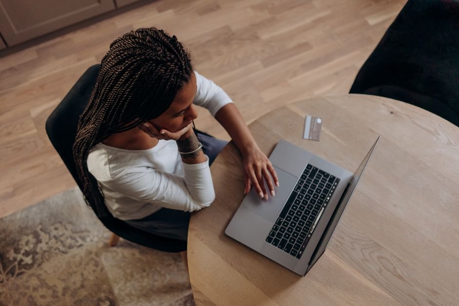 Freelancer reviewing template options on laptop