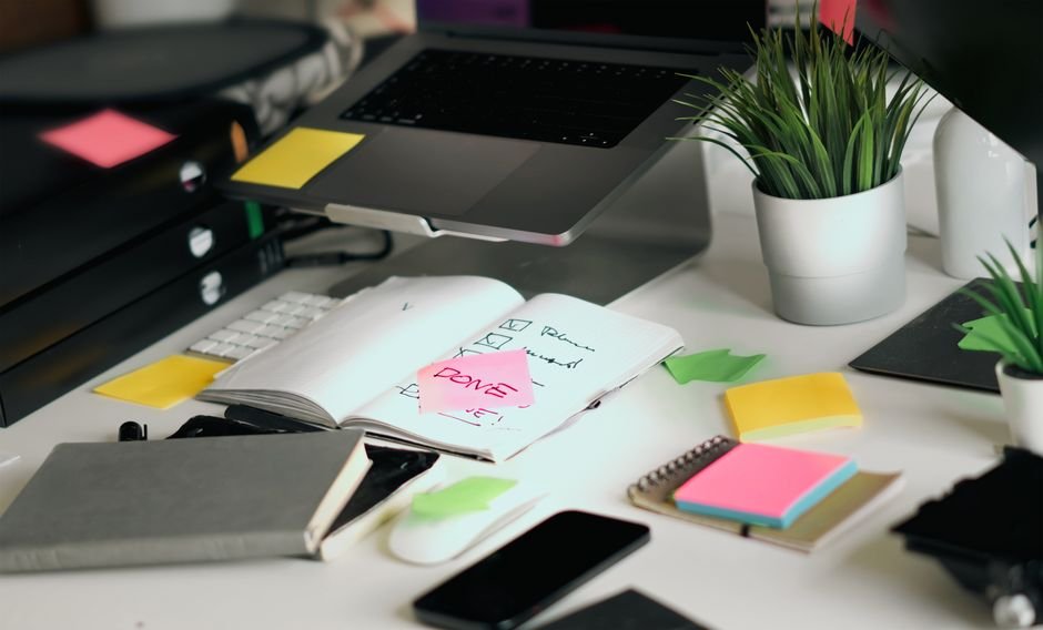 Checklist and notebook on desk for tracking business routines