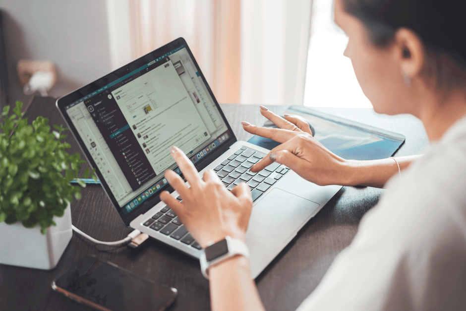 Laptop open on desk showing job search workflow